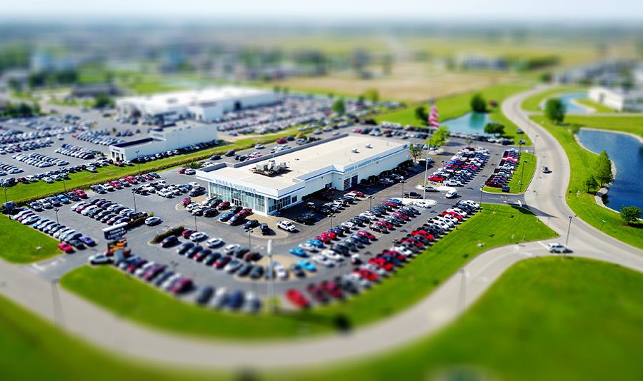 an aerial shot of a large auto dealership